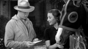 Кадры из фильма Женщина в красном / The Woman in Red (1935)